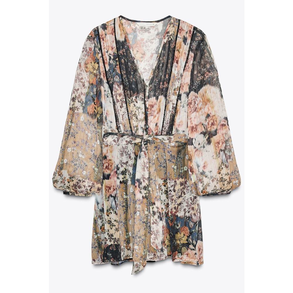 V-neck long sleeve dress. Front pintucks and lace inserts. Elastic waist